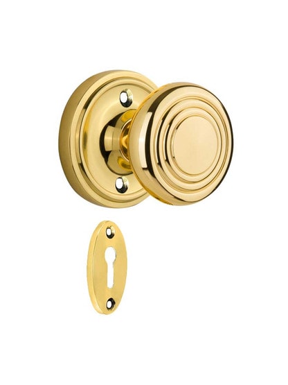 Classic Rosette Mortise Lock Set with Deco Style Knobs in Polished Brass.